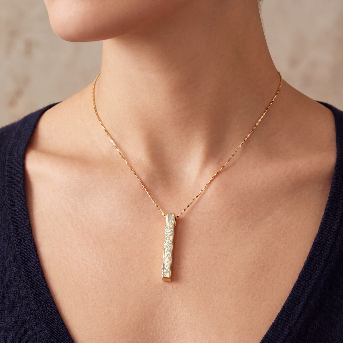 Model wearing the December Narcissus birth flower necklace in 14K gold plated