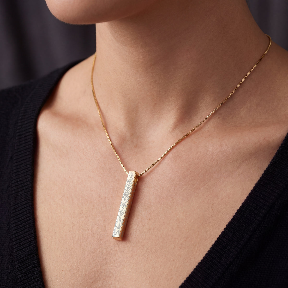 Model wearing the July Larkspur birth flower necklace in 14K gold plated