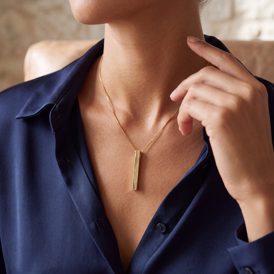 Model wearing the March Daffodil birth flower necklace in 14K gold plated