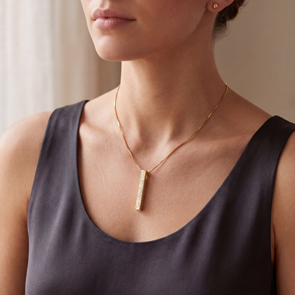 Model wearing the May Lily of the Valley birth flower necklace in 14K gold plated