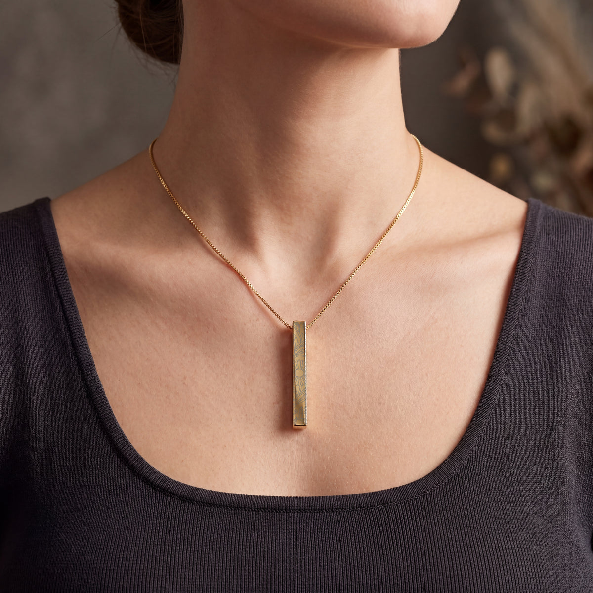 Model wearing the September Aster birth flower necklace in 14K gold plated
